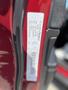 A close-up of a 2015 Jeep Grand Cherokee door sticker displaying vehicle information and specifications