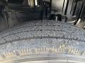 Close-up of a tire from a 2018 Hino 195 showing tread pattern with dirt and debris on the surface