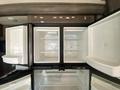An open refrigerator with empty compartments and a clean interior in a 2021 Grand Design Recreational ST3478MBS