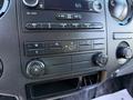 Dashboard controls of a 2017 Ford F-650 Super Duty featuring audio and climate control buttons with a digital display for time