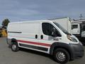 A 2017 RAM Promaster van with a white exterior and red stripes on the side