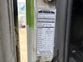 A service label attached to a 2011 Autocar Xpeditor detailing maintenance performed and mileage information