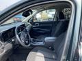Interior of a 2022 Kia Sorento showing front seats steering wheel and dashboard