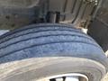 Close-up of a worn tire from a 2014 Hino 195 showing visible tread wear and cracks on the surface