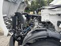 A 2018 Ford F-750 with its hood open showing the engine compartment and mechanical components including hoses and electrical parts