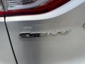 A 2015 Ford Escape badge displayed on the rear of the vehicle