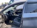 Interior view of a 2017 Nissan Murano featuring black leather seats a steering wheel and control panel