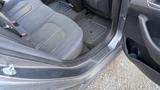 A 2018 Hyundai Sonata interior showing the front passenger seat with fabric upholstery and a rubber floor mat