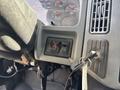 Interior view of a 2006 International 4300 showing the dashboard controls ignition key and two switches