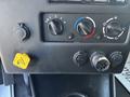 Dashboard controls of a 2022 Lion Lion6 featuring knobs for temperature and fan settings along with plugs for power and connections