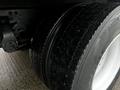 Close-up of a dual rear tire of a 2017 Hino 338 showing its tread pattern and shiny rim