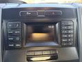 Dashboard of a 2018 Ford F-350 featuring a digital display clock and various control buttons for media and navigation