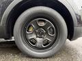 Close-up of a black wheel on a 2019 Ford Explorer with a circular design and six spokes featuring a smooth matte finish