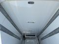 Interior of a 2016 Mercedes-Benz Sprinter van showing a spacious and clean cargo area with metal tracks for securing cargo and overhead lighting