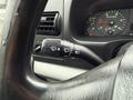 A close-up of the control stalk in a 2006 Ford F-450 featuring settings for headlights and windshield wipers