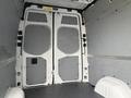 Interior view of a 2023 Mercedes-Benz Sprinter van showcasing the rear double doors and empty cargo space