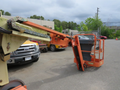 Orange 2009 JLG E300AJP aerial lift with extended boom and platform for personnel use