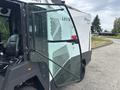 A 2019 Madvac LS175 litter collection machine featuring a transparent door and joystick controls inside the cabin