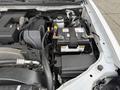 The image shows the engine compartment of a 2012 GMC Canyon with visible components including the battery hoses and engine parts