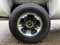 Close-up of a chrome wheel rim with a Chevrolet logo on a tire of a 2013 Chevrolet Silverado 3500HD