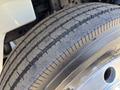 Close-up of a tire on a 2008 International DuraStar showing tread patterns and sidewall details
