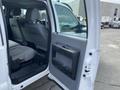 A 2015 Ford F-550 with an open door showing the interior seating and controls