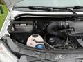 Close-up of the engine compartment of a 2017 Mercedes-Benz Sprinter featuring the air filter housing and various engine components including hoses and fluid reservoirs