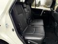 Interior view of the backseat of a 2018 Toyota 4Runner featuring black leather upholstery and seating for three passengers