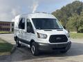A 2016 Ford Transit 150 cargo van with a white exterior and black accents parked on a concrete surface