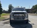A 2019 Ford F-550 truck facing forward with a chrome grille and hood lights