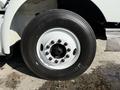A close-up view of a tire mounted on a 2007 International 9200i truck featuring a silver rim and black sidewall with visible tread pattern and lug nuts