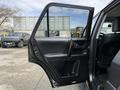 A 2021 Toyota 4Runner with an open front door displaying the interior design and features