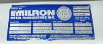 A blue label from Milron Metal Fabricators Inc displaying vehicle specifications and safety standards for a 2005 Freightliner M2 106 model