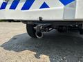 A 2017 Chevrolet Colorado with a visible tow hitch and a safety hook attached