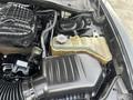 The image shows the engine compartment of a 2015 Dodge Charger featuring the air intake system and a coolant reservoir tank