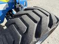 Close-up of a large, rugged tire with deep treads designed for a Genie Z 45/25 lift vehicle showing wear and texture