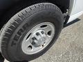 Close-up of a tire and wheel of a 2017 Chevrolet Express featuring a silver rim and a treaded tire with the text TERRA TRAC CHO OS on the sidewall