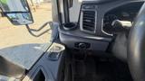 Interior view of a 2021 Ford Transit showing the dashboard control panel and gear shift area
