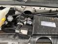 A 2020 Chevrolet Express engine with visible components including the air intake and labeled Vortec engine cover