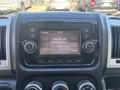 Dashboard display of a 2020 RAM ProMaster 3500 showing a digital screen with options for radio settings and pairing devices