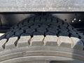 Close-up of a heavily treaded tire from a 2005 GMC C7500 Topkick showing detailed patterns and grooves