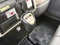 Close-up of a gear shift lever labeled Eaton in the interior of a 2011 International 4300 truck