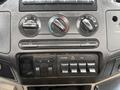 Dashboard controls of a 2008 Ford F-550 featuring knobs for temperature and air conditioning along with several toggle switches for various functions