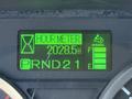 A digital display showing an hour meter at 2028.5 hours with indicators for temperature and fuel level along with a gear shift display for PRND21