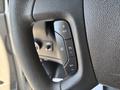 A close-up of the steering wheel of a 2020 Chevrolet Express showing the cruise control buttons including set plus minus and resume