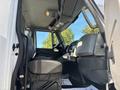Interior view of a 2013 International 7500 truck showing the driver's seat dashboard and steering wheel