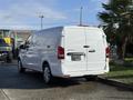 A white 2020 Mercedes-Benz Metris van is parked with its rear doors closed and the license plate area blank