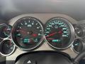 Dashboard of a 2013 Chevrolet Silverado 3500HD showing speedometer and tachometer with illuminated gauges and digital display for odometer and trip information