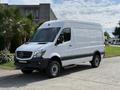 A 2017 Mercedes-Benz Sprinter van with a white exterior and black trim featuring large wheels and a high roof