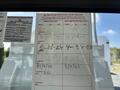 A 2019 Freightliner M2 106 displaying an inspection record document adhered to the window with various dates and notes written in ink